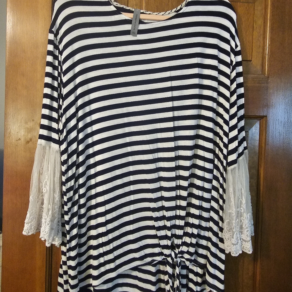 Super soft boutique top with beautiful soft lace bell sleeve and front tie